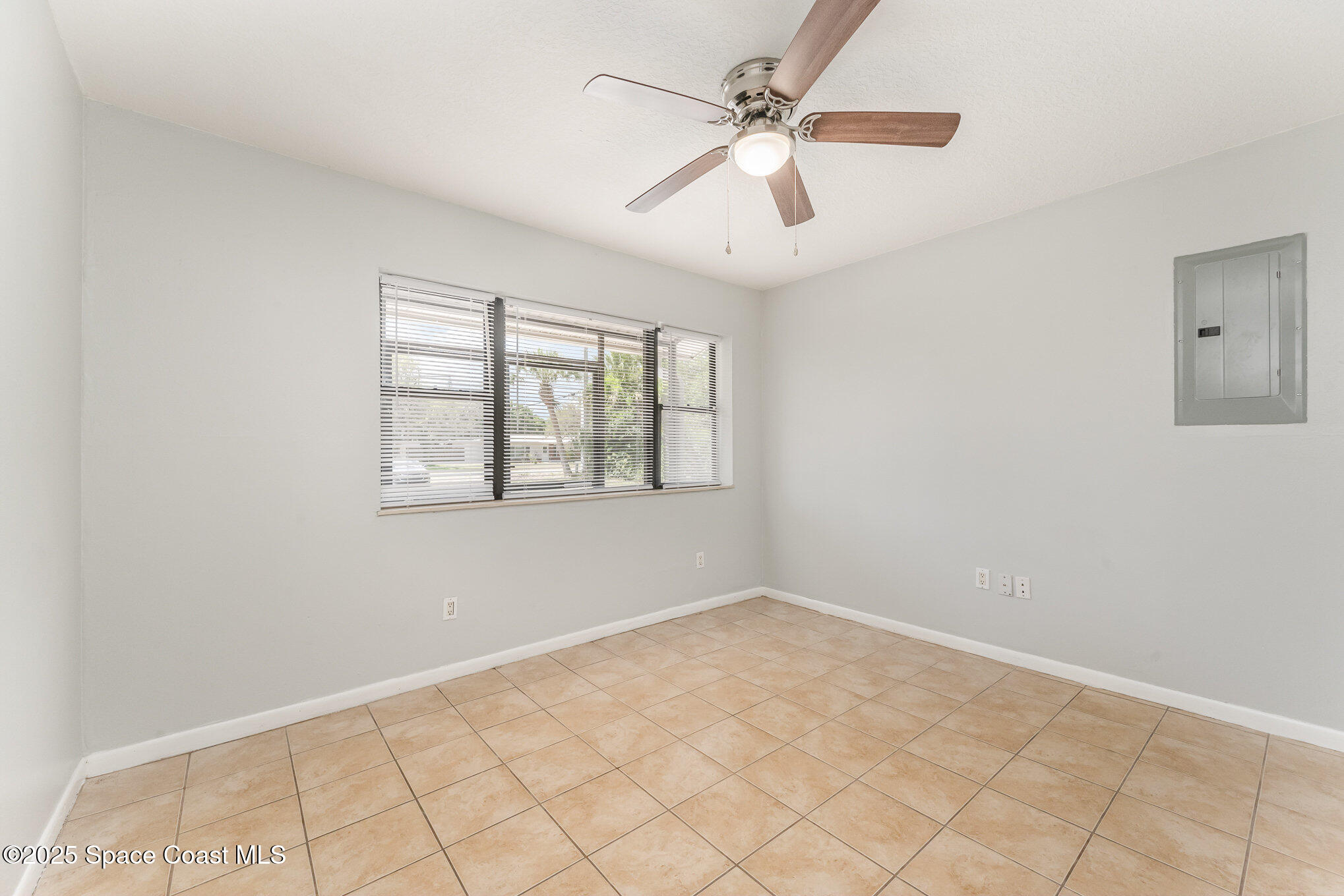 1981 Roc Rosa Drive Northeast Palm Bay, FL 32905 - Photo 11 of 29 a view of an empty room with a window