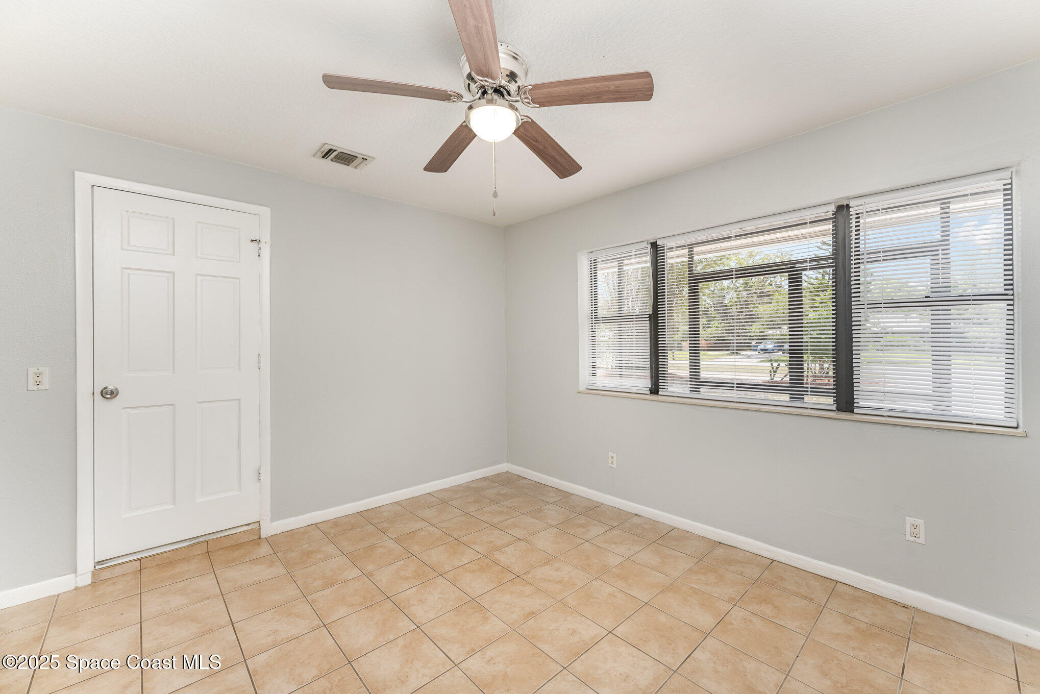 1981 Roc Rosa Drive Northeast Palm Bay, FL 32905 - Photo 12 of 29 a view of an empty room with a window