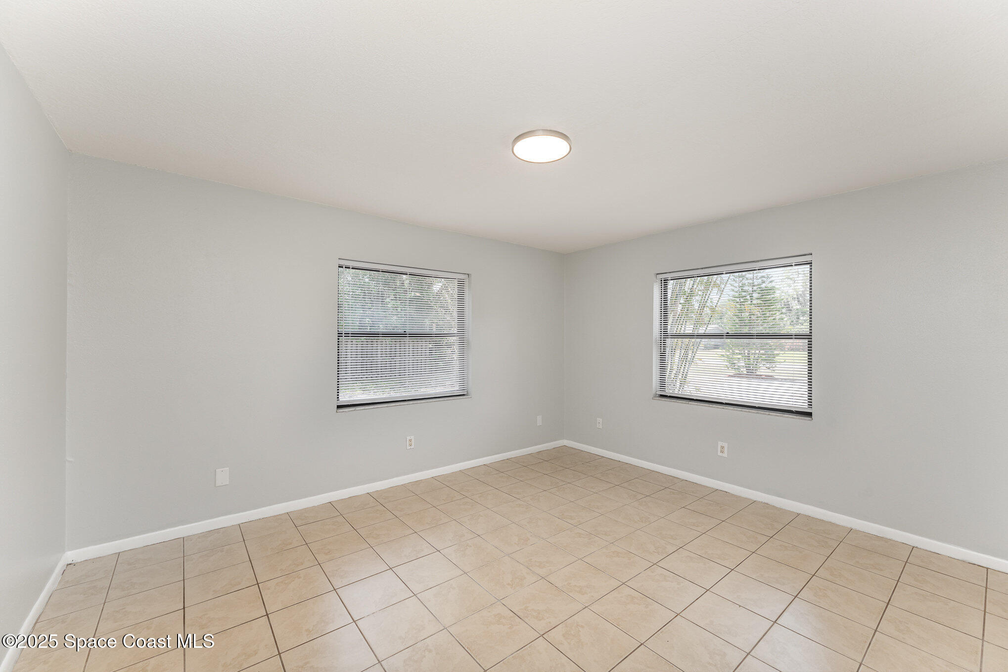 1981 Roc Rosa Drive Northeast Palm Bay, FL 32905 - Photo 16 of 29 a view of an empty room with window