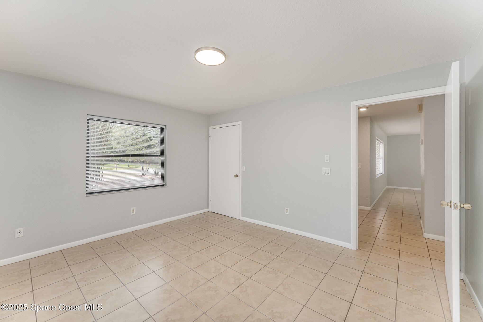 1981 Roc Rosa Drive Northeast Palm Bay, FL 32905 - Photo 17 of 29 a view of an empty room with window