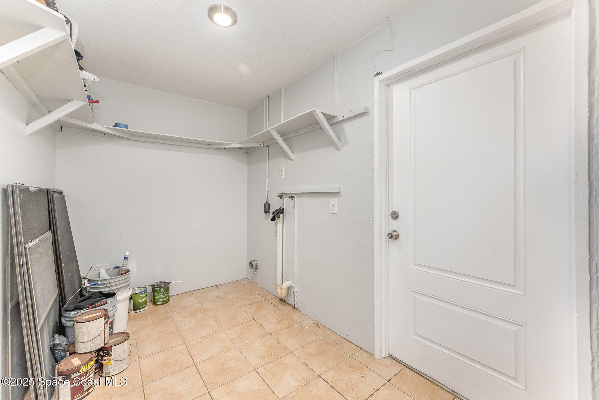 1981 Roc Rosa Drive Northeast Palm Bay, FL 32905 - Photo 21 of 29 a view of a storage & utility room with two washing machine