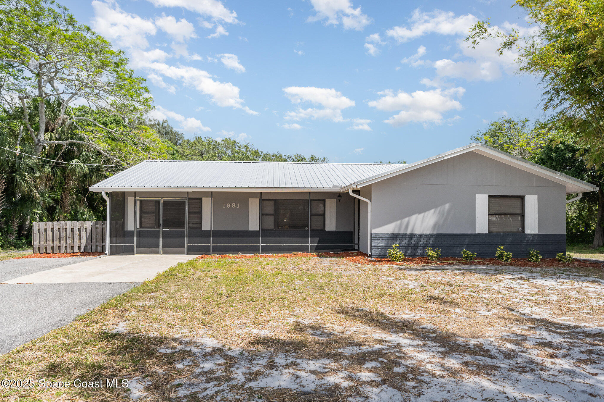 1981 Roc Rosa Drive Northeast Palm Bay, FL 32905 - Photo 29 of 29 a front view of house with yard outdoor seating and barbeque oven