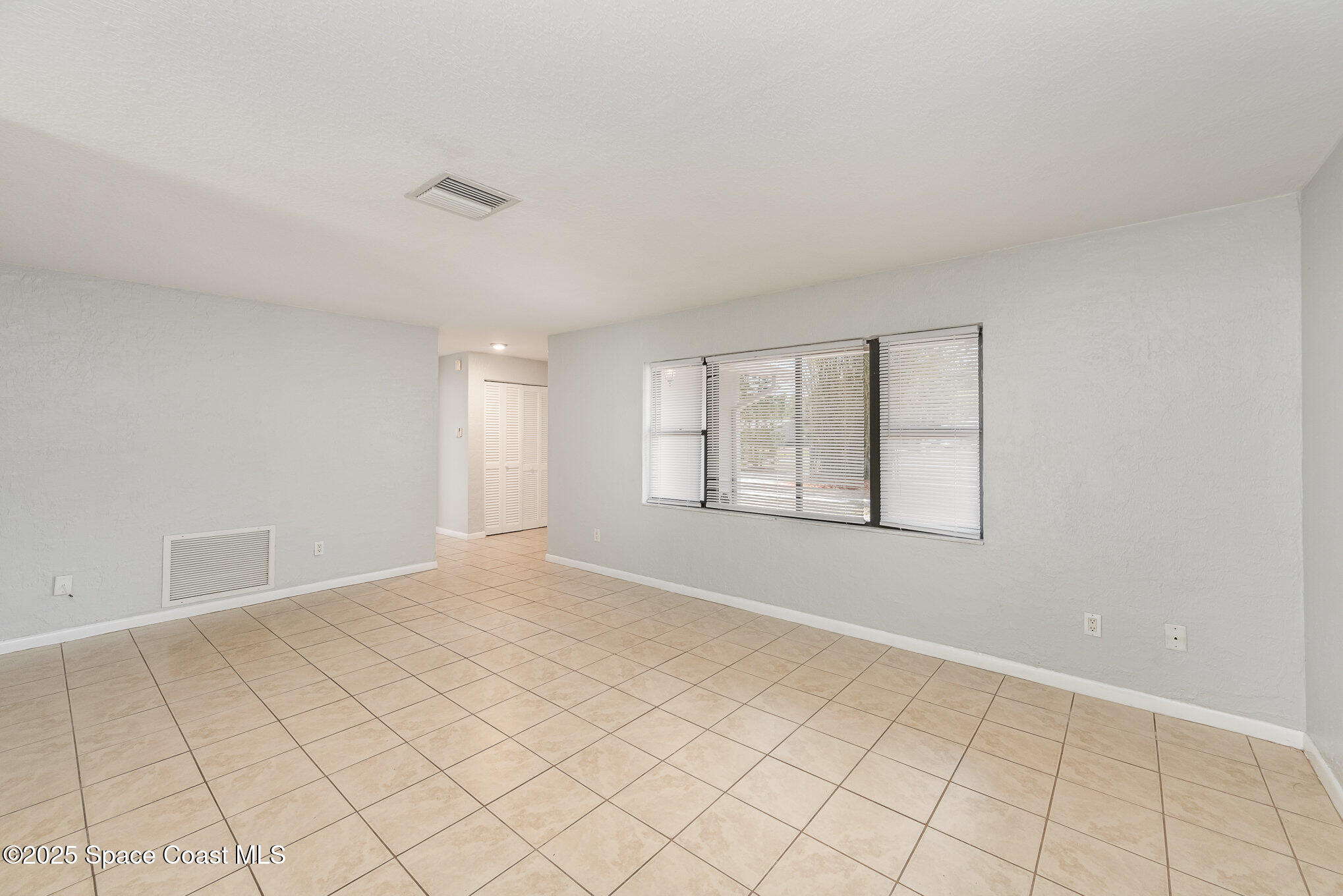 1981 Roc Rosa Drive Northeast Palm Bay, FL 32905 - Photo 3 of 29 a view of an empty room with window