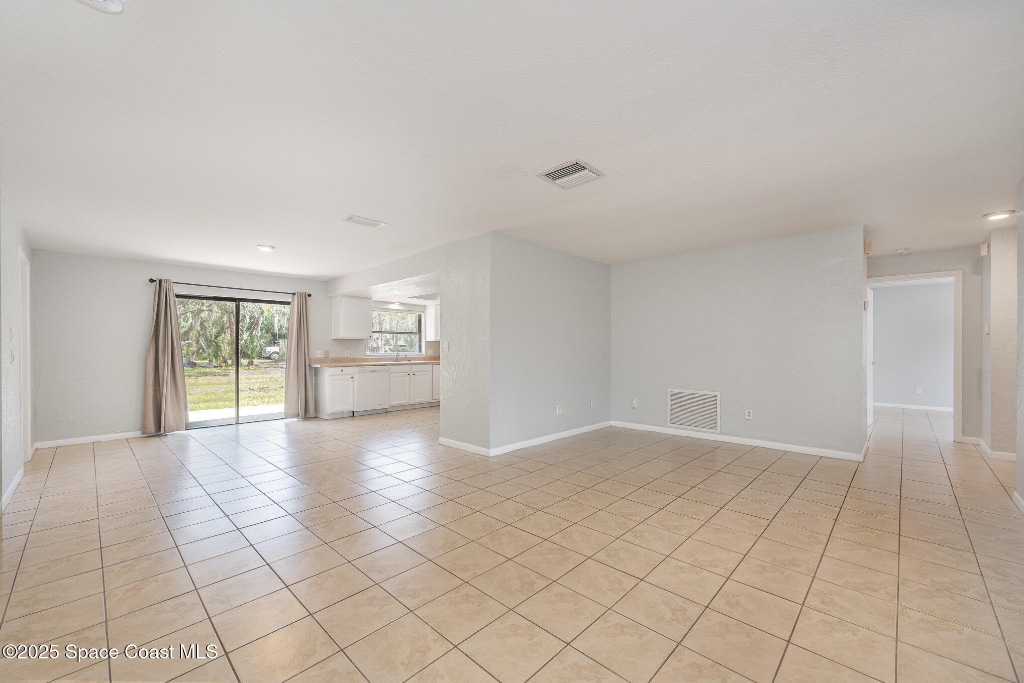 1981 Roc Rosa Drive Northeast Palm Bay, FL 32905 - Photo 5 of 29 a view of an empty room with a window