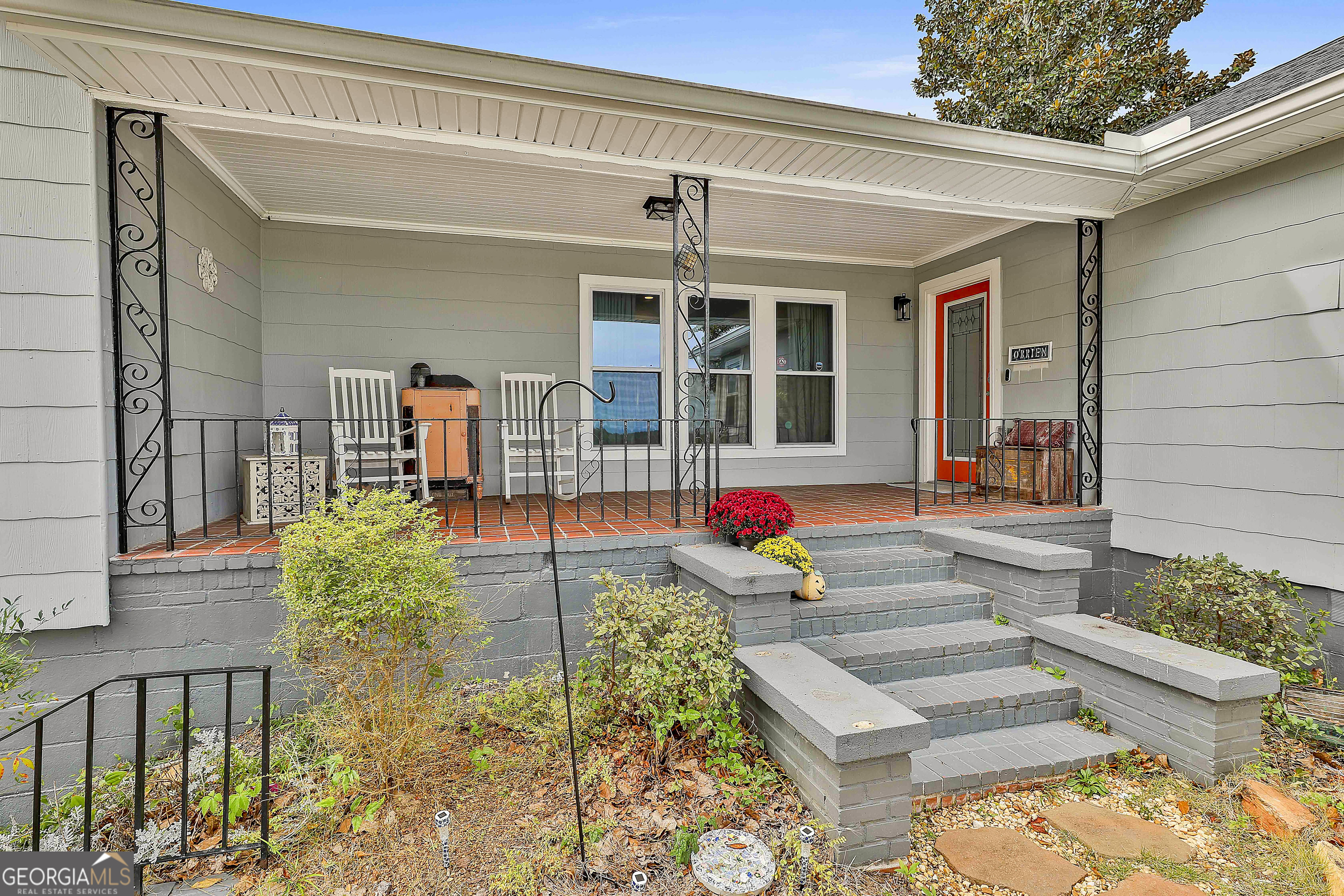 a front view of a house with garden
