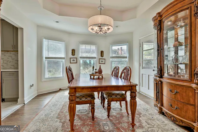 a view of a dining room with furniture window and wooden floor