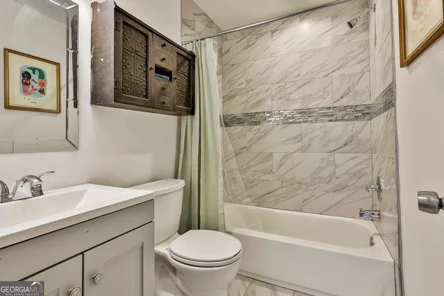 a view of a hallway with wooden floor and workspace