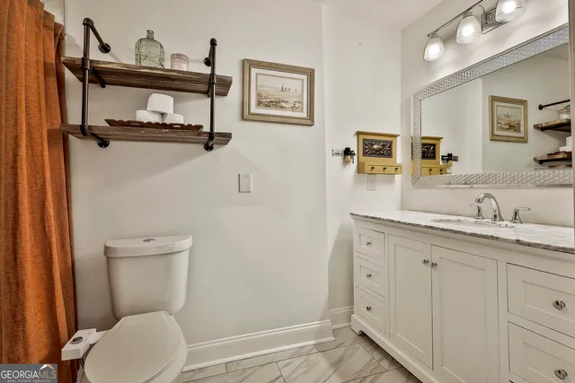 a sitting area with furniture and a rug