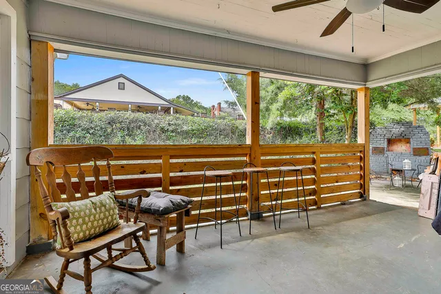 a view of a livingroom with furniture and a window