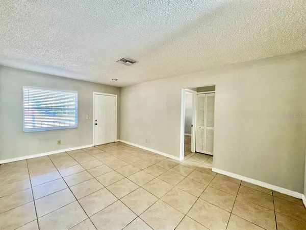 a view of an empty room and window