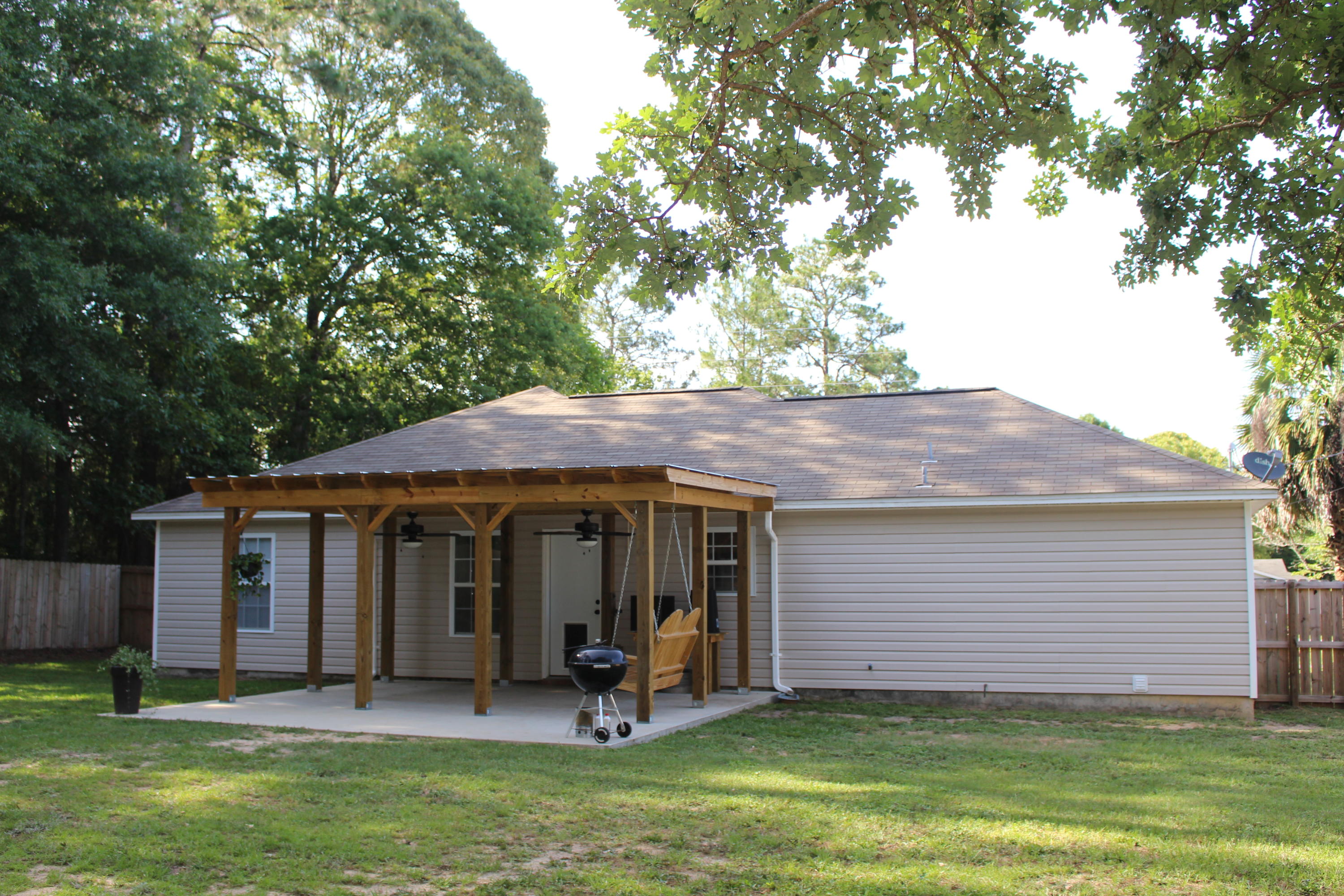 3094 Auburn Road Crestview, FL 32539 - Photo 22 of 25 a view of a chair and table in backyard of the house