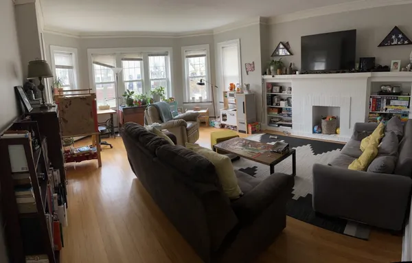 a living room with furniture fireplace and flat screen tv