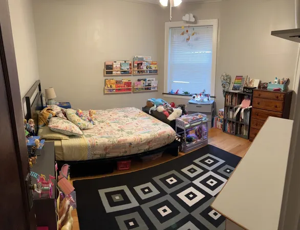 a bedroom with a bed and a table in it