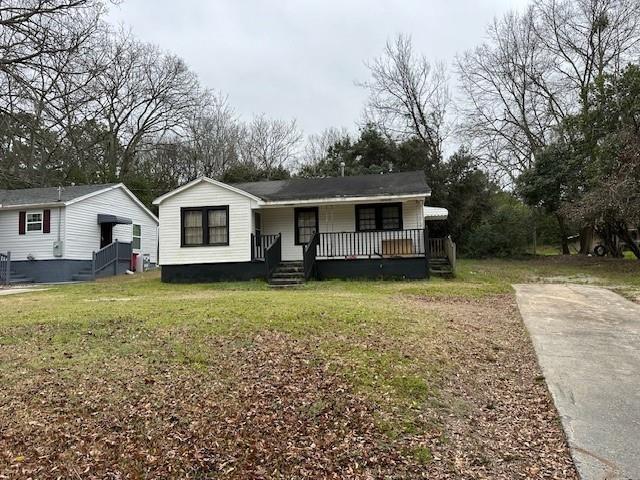 a view of a house with a yard