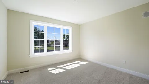 a view of empty room with windows