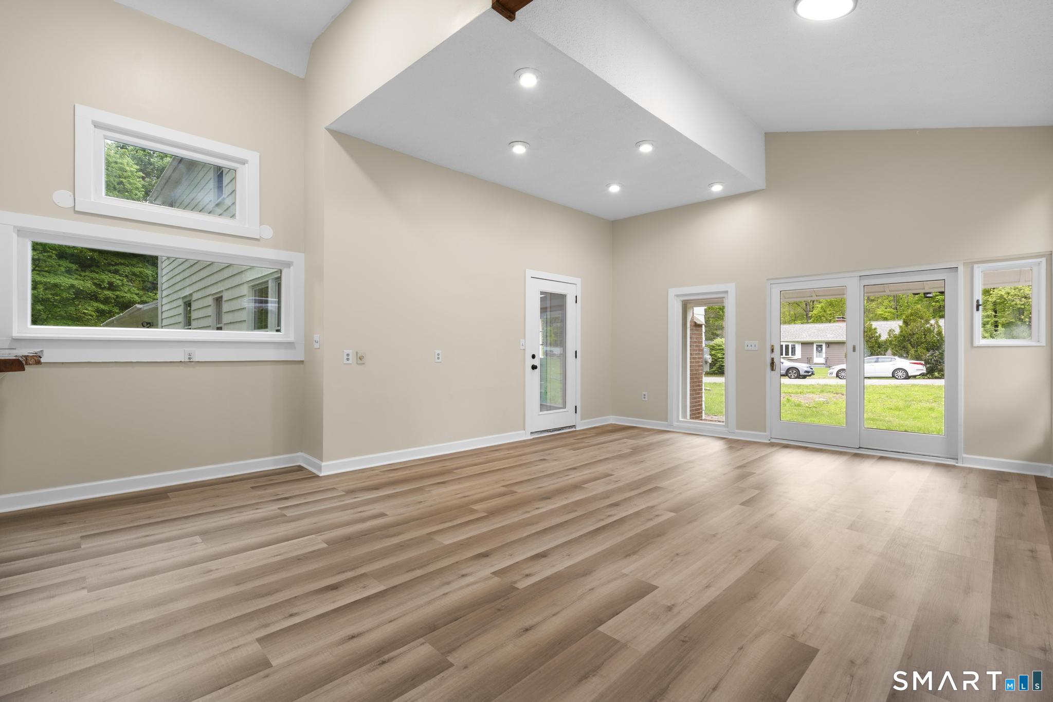 7 Sycamore Terrace Windham, CT 06280 - Photo 14 of 40 a view of an empty room with wooden floor and a window