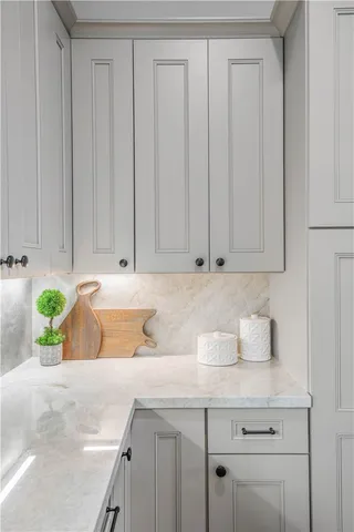 a bathroom with a sink and cabinets