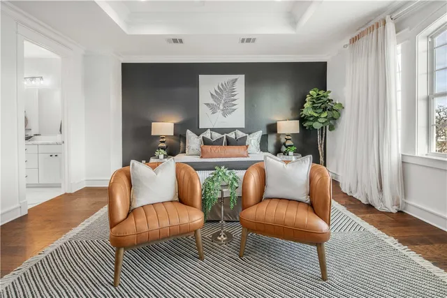 a bedroom with a bed and lamp