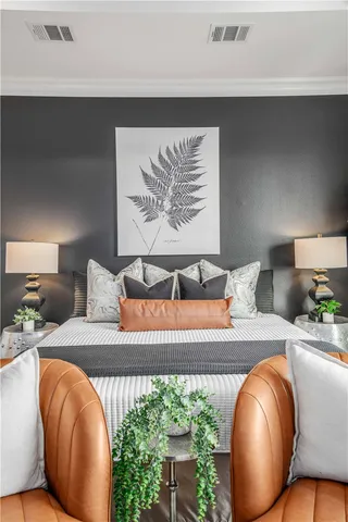 a bedroom with furniture and wooden floor