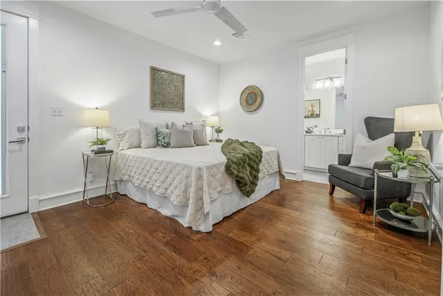 a bedroom with a bed and a lamp