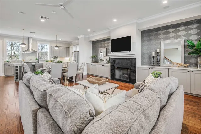 a living room with fireplace furniture and a flat screen tv