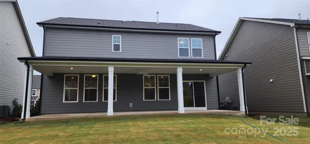 a house that has a window in front of a house