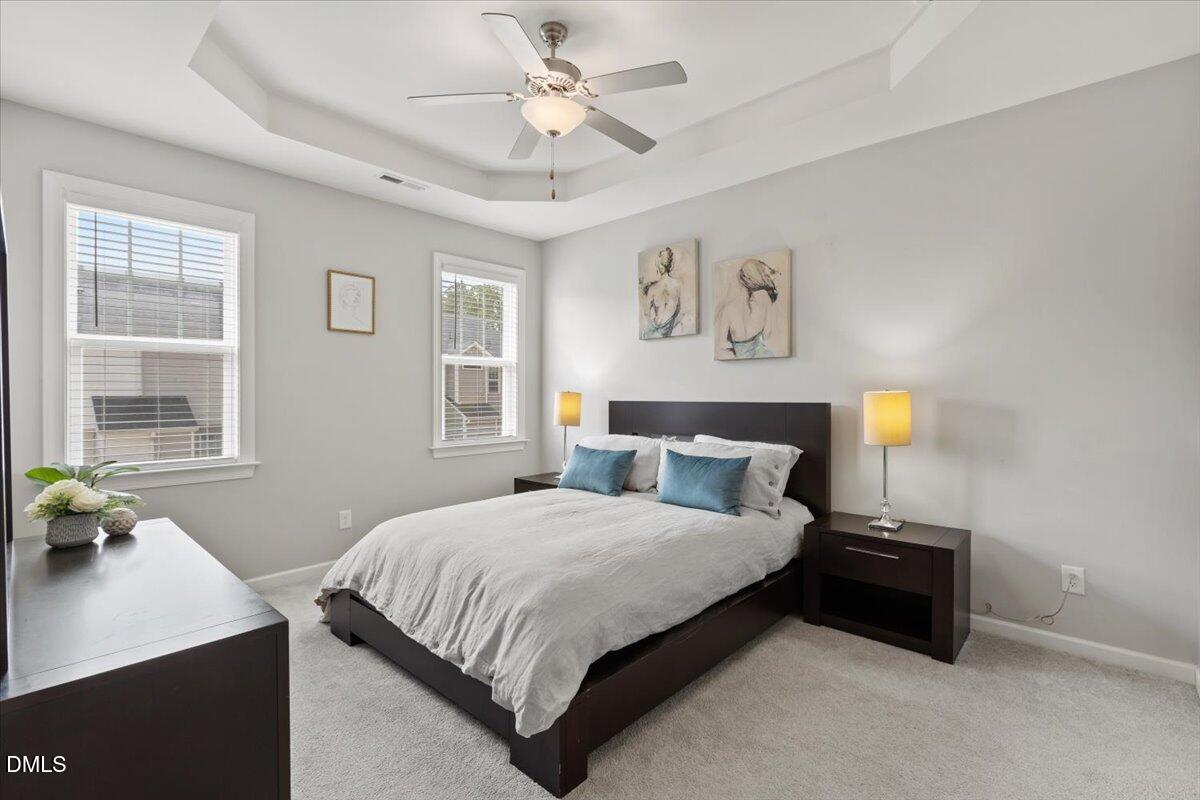 435 Leighann Ridge Lane Rolesville, NC 27571 - Photo 11 of 21 a bedroom with a bed and a window