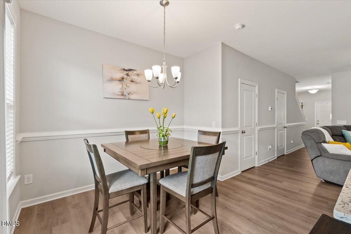 435 Leighann Ridge Lane Rolesville, NC 27571 - Photo 8 of 21 a view of a dining room with furniture and wooden floor