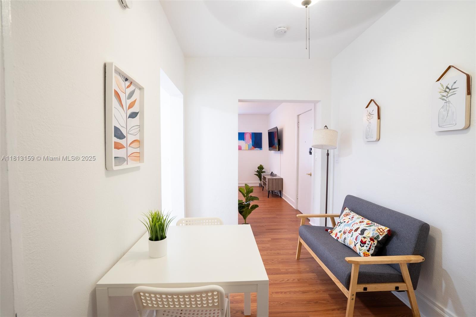 444 Ponce De Leon Boulevard, Unit 6 Coral Gables, FL 33134 - Photo 18 of 22 a living room with furniture and a rug