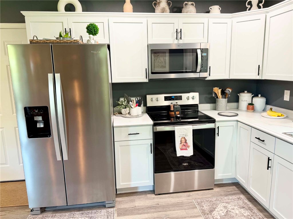 1108 South 3rd Street Effingham, IL 62401 - Photo 4 of 29 a kitchen with stainless steel appliances granite countertop a refrigerator sink and stove