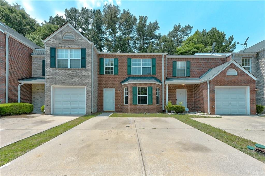 1507 Eastern Sunrise Lane Decatur, GA 30034 - Photo 1 of 1 a front view of a house with a garden