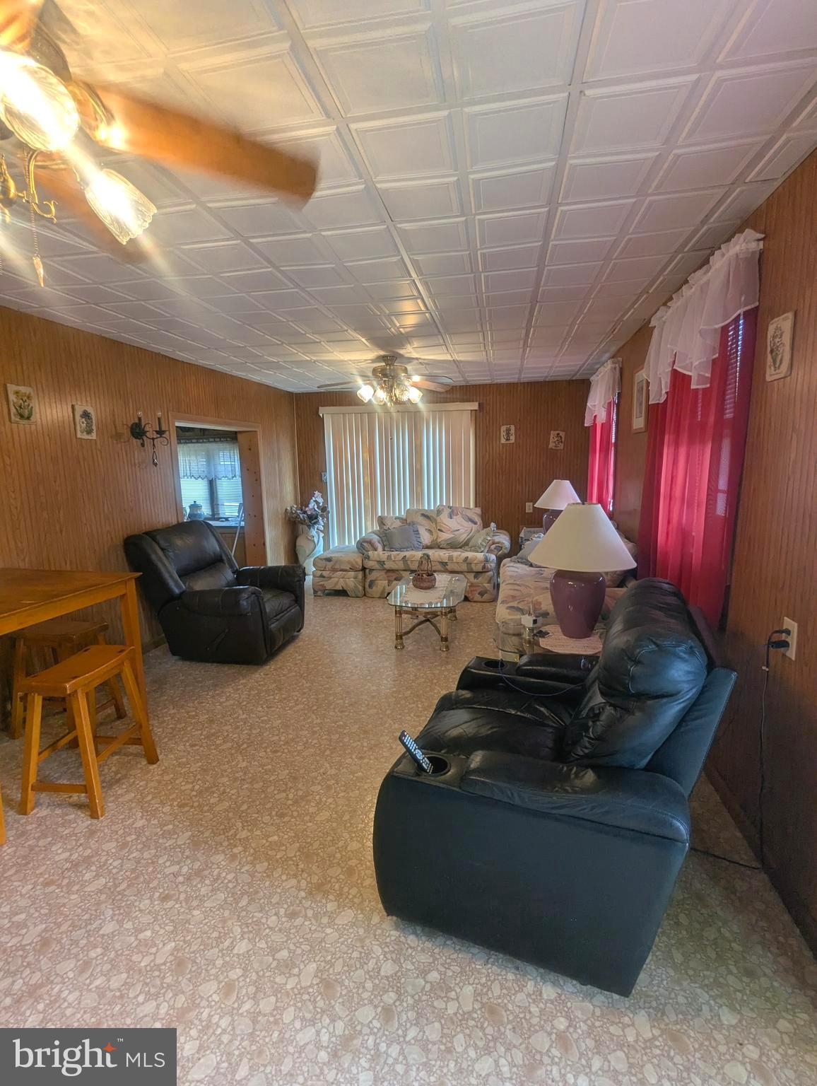 4 Hilo Road Falling Waters, WV 25419 - Photo 13 of 13 a room with furniture and a chandelier