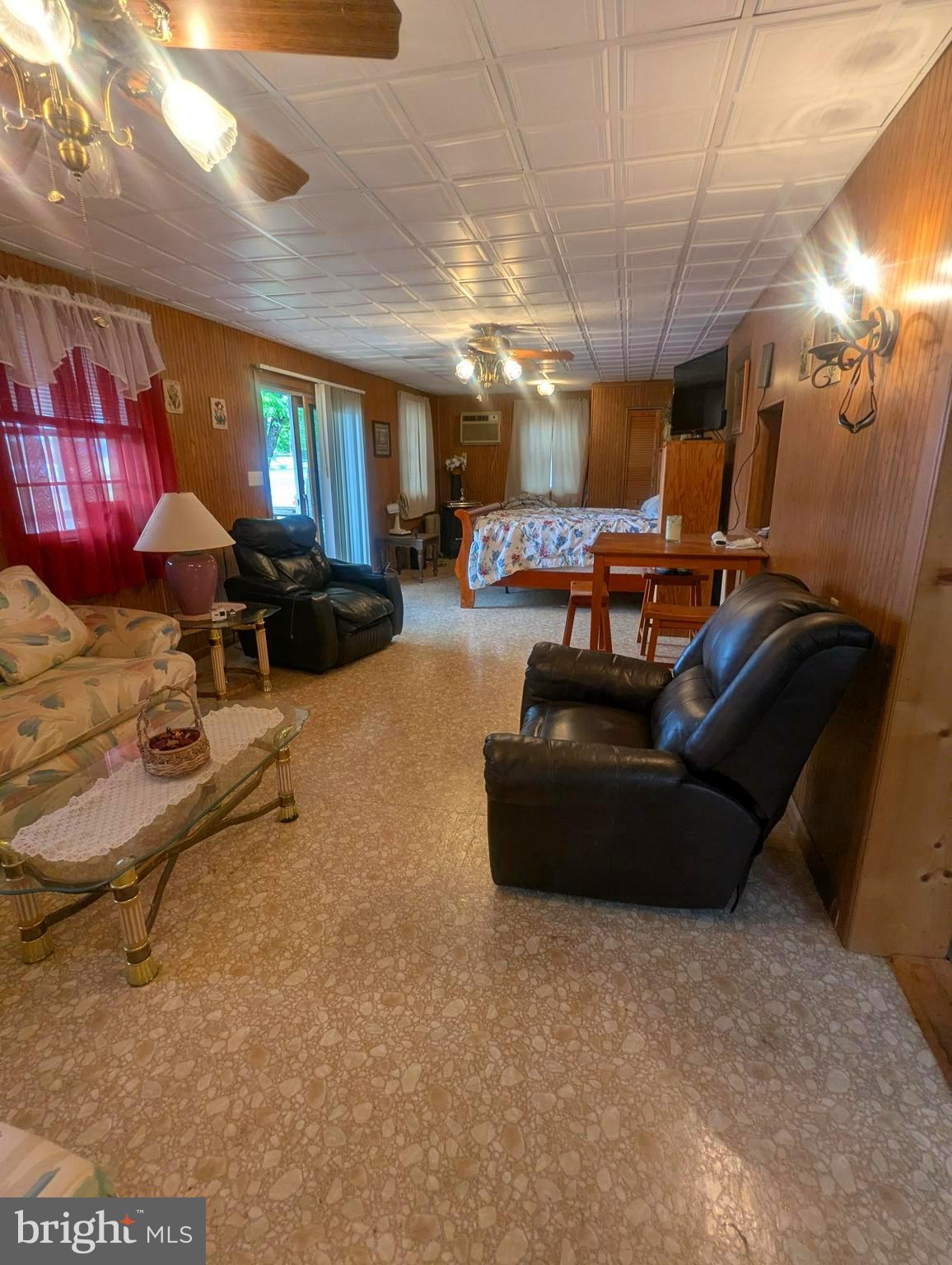4 Hilo Road Falling Waters, WV 25419 - Photo 5 of 13 a living room with furniture a lamp and a window