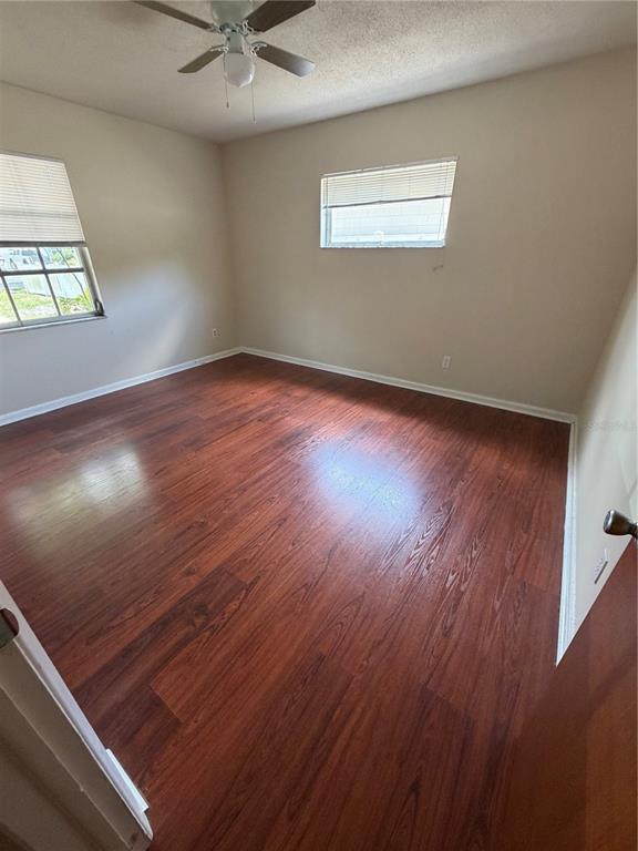 517 London Road Winter Park, FL 32792 - Photo 9 of 13 an empty room with wooden floor and windows