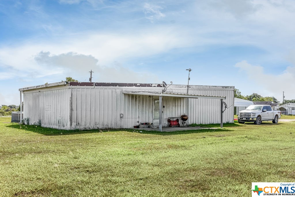 Multiple Danny Lane Port Lavaca, TX 77979 - Photo 2 of 7 a view of a front of house with yard