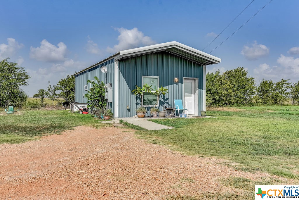 Multiple Danny Lane Port Lavaca, TX 77979 - Photo 3 of 7 a view of a house with yard and a garden