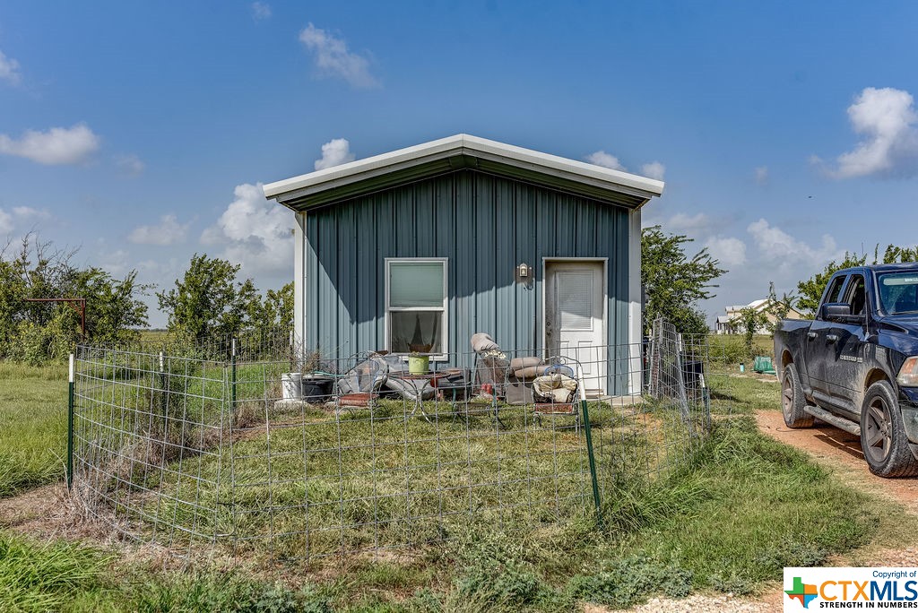 Multiple Danny Lane Port Lavaca, TX 77979 - Photo 4 of 7 a backyard of a house with table and chairs