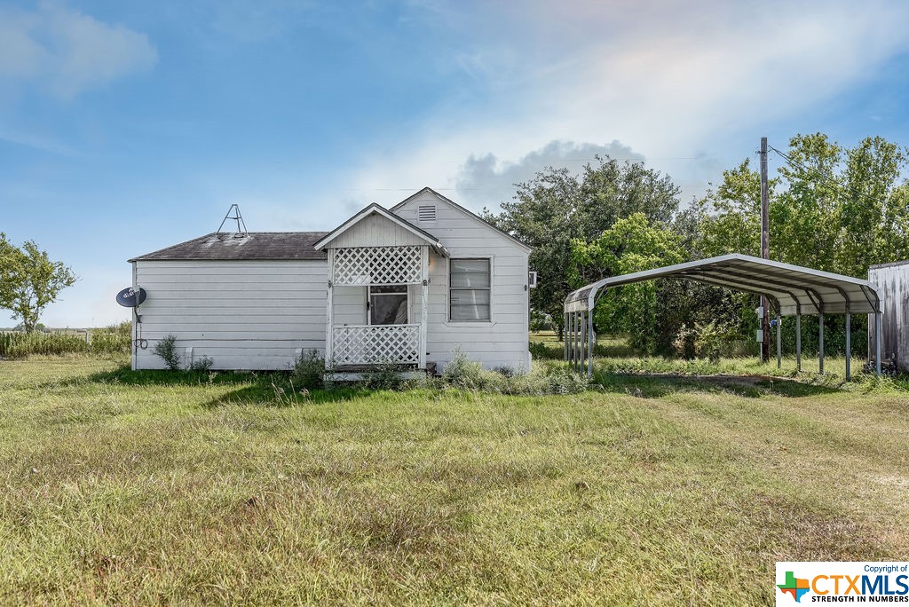 Multiple Danny Lane Port Lavaca, TX 77979 - Photo 5 of 7 a backyard of a house with table and chairs
