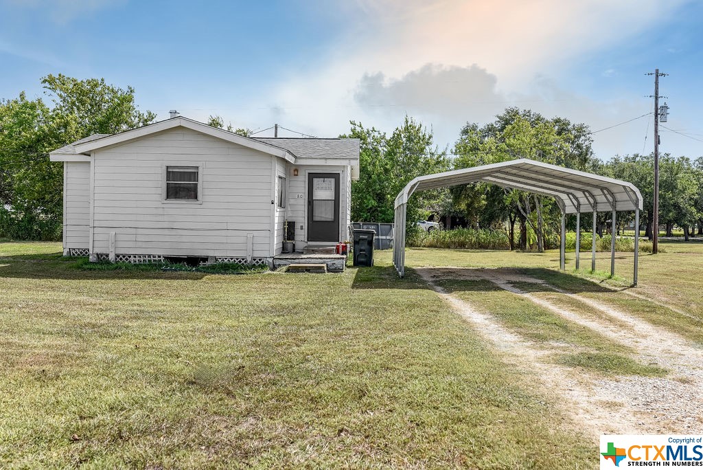 Multiple Danny Lane Port Lavaca, TX 77979 - Photo 6 of 7 a view of a house with backyard and trees