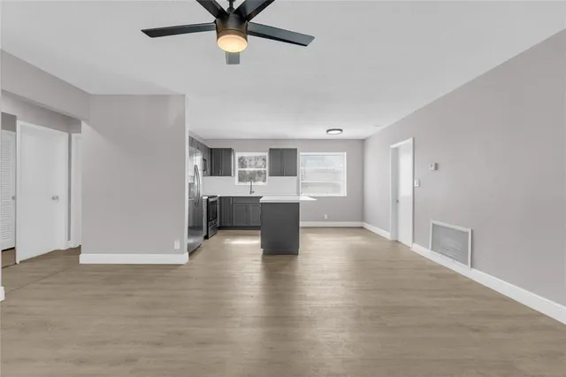a view of a kitchen with a sink cabinets and window