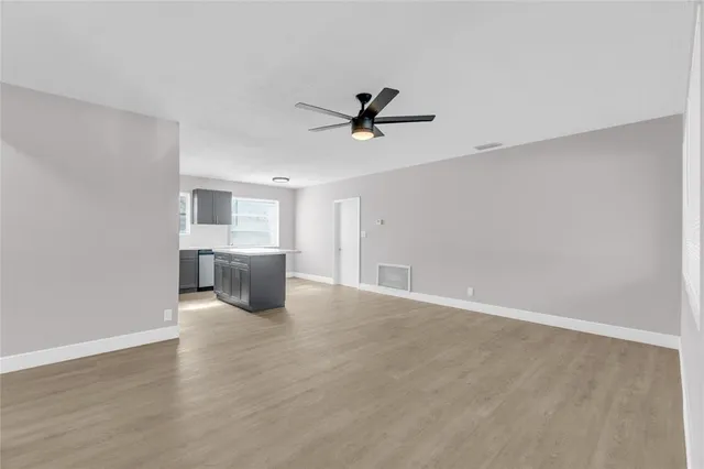 a view of a kitchen with a sink and cabinet area