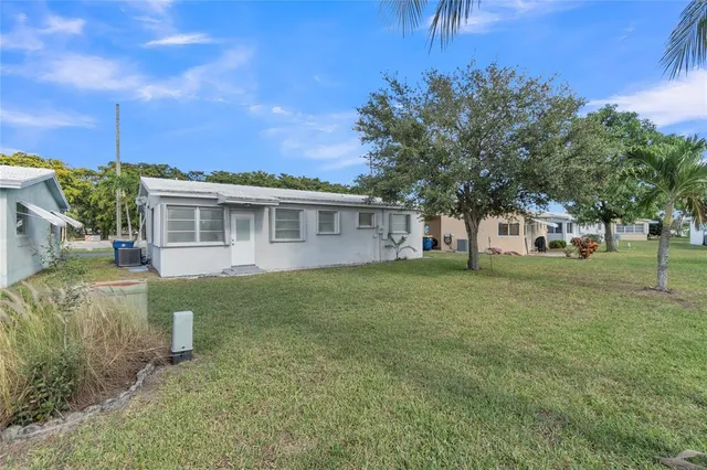 a view of a house with a back yard