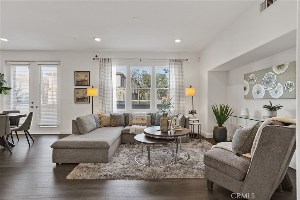30 Moonstone Irvine, CA 92602 - Photo 2 of 7 a living room with furniture and floor to ceiling windows