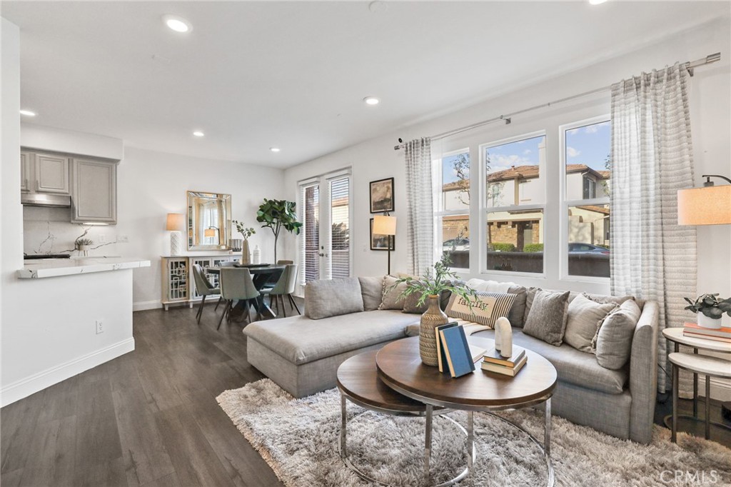 30 Moonstone Irvine, CA 92602 - Photo 3 of 7 a living room with furniture kitchen view and large windows