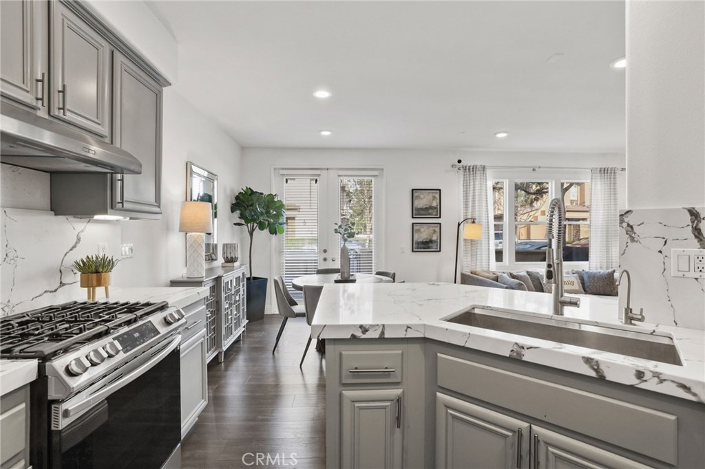 30 Moonstone Irvine, CA 92602 - Photo 5 of 7 a kitchen with stainless steel appliances granite countertop a stove and a sink