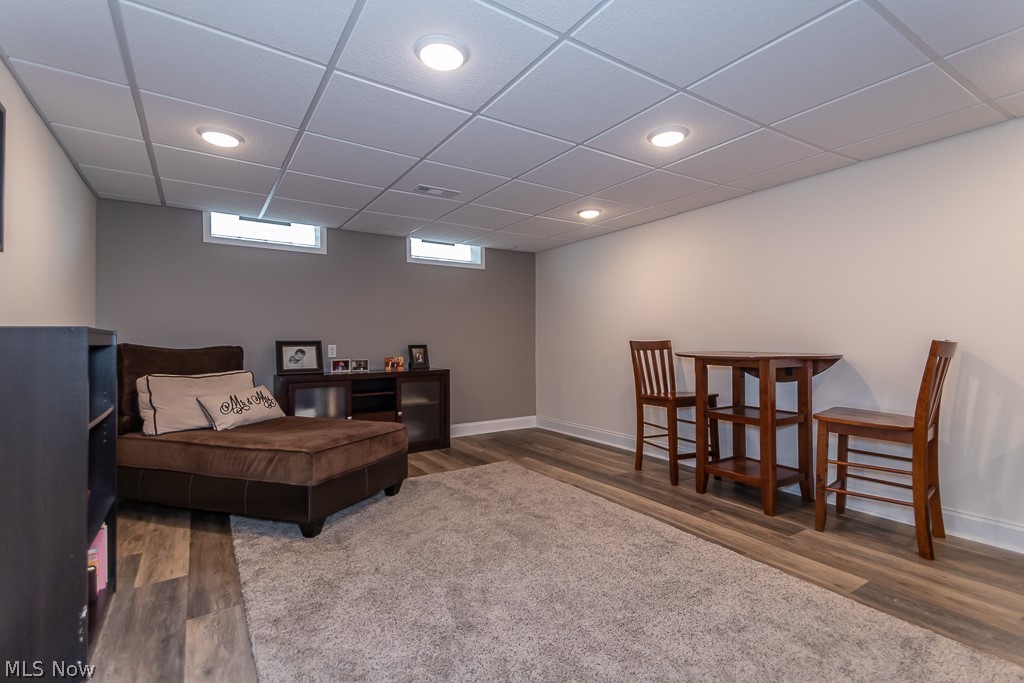 990 Roland Road Cleveland, OH 44124 - Photo 27 of 30 Lower level Recreation room has LVT flooring and lots of lighting.