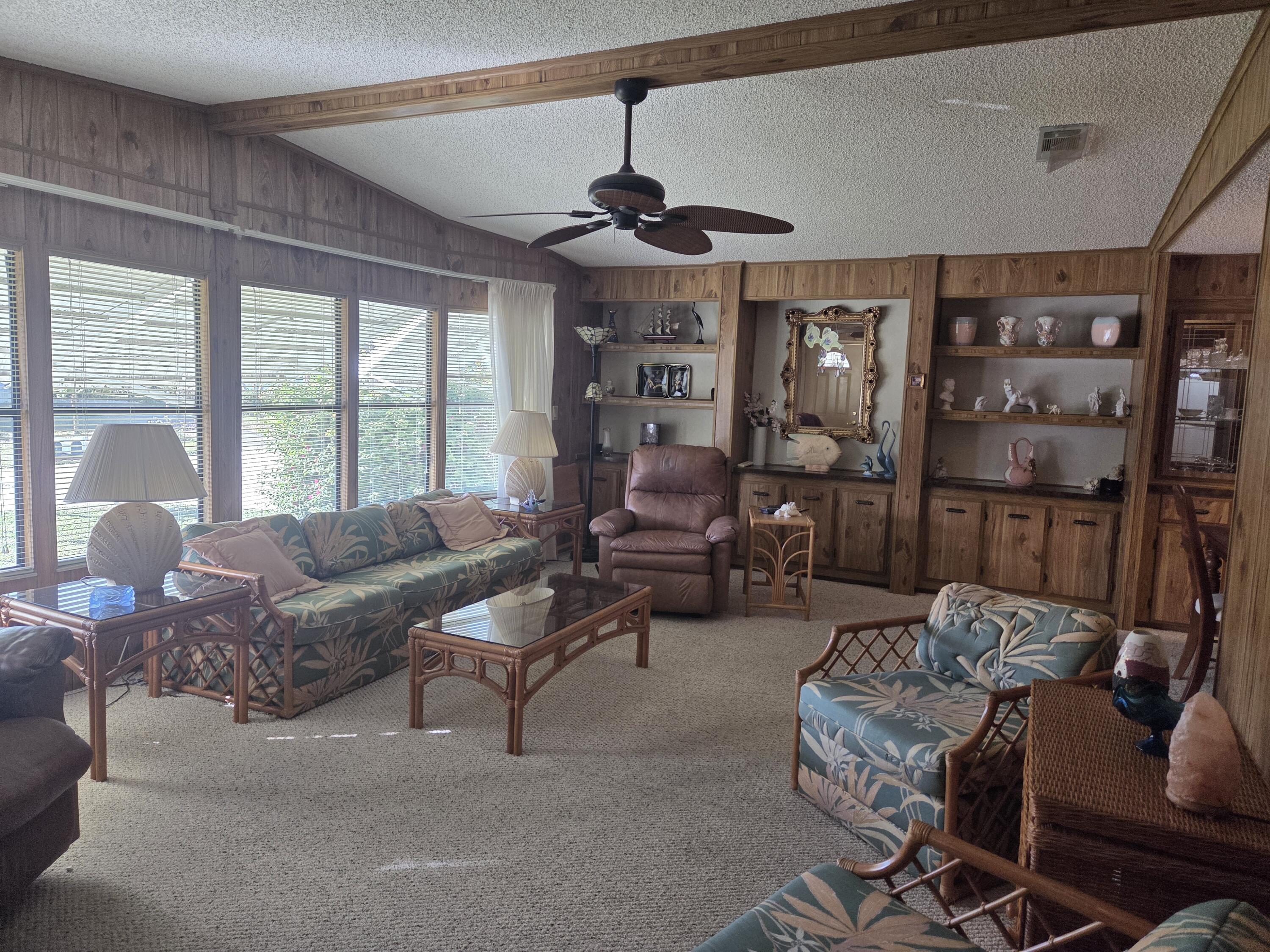 7375 Southeast Independence Avenue Hobe Sound, FL 33455 - Photo 16 of 25 a living room with furniture and a large window