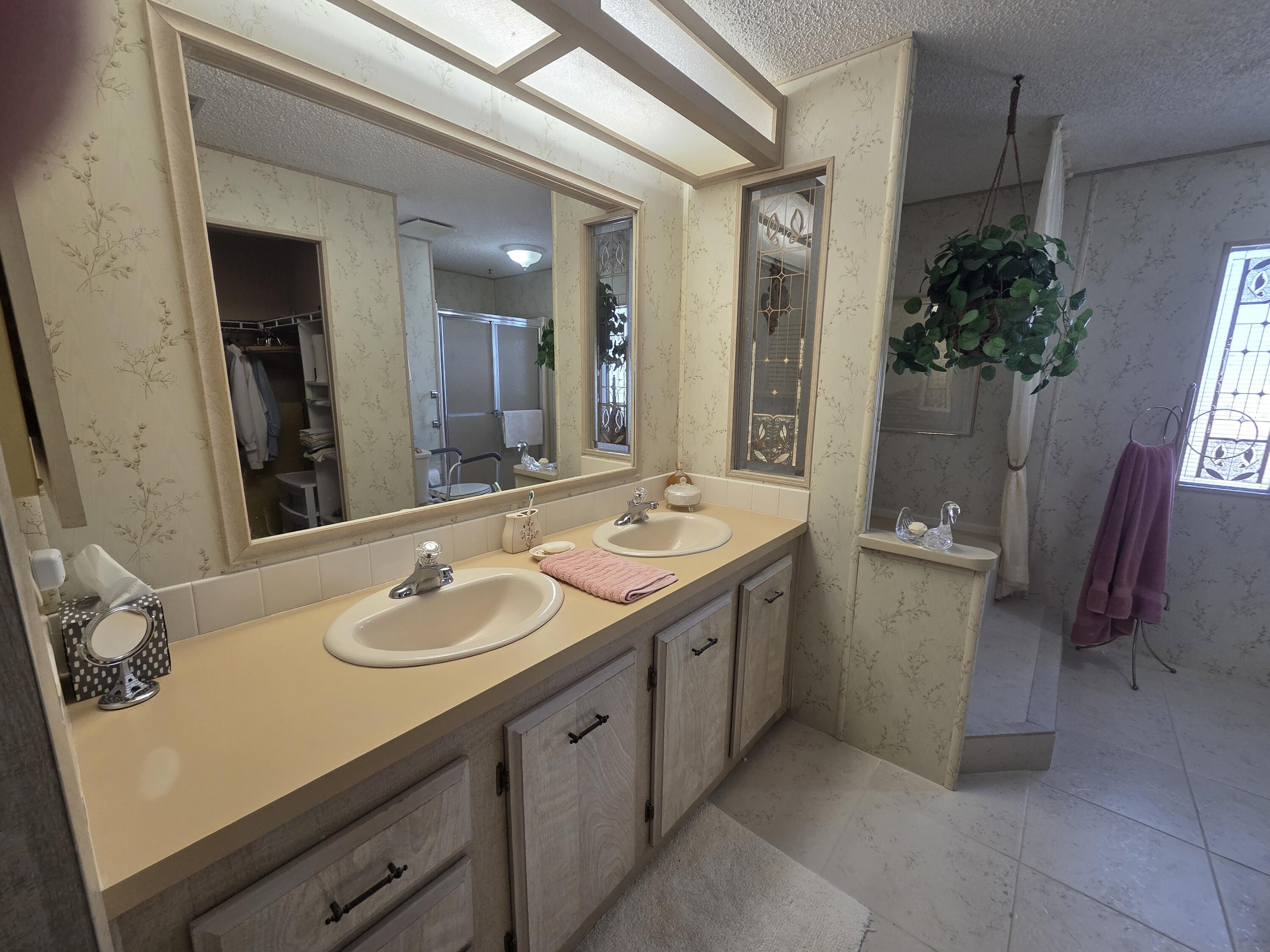 7375 Southeast Independence Avenue Hobe Sound, FL 33455 - Photo 20 of 25 a bathroom with a sink and a mirror