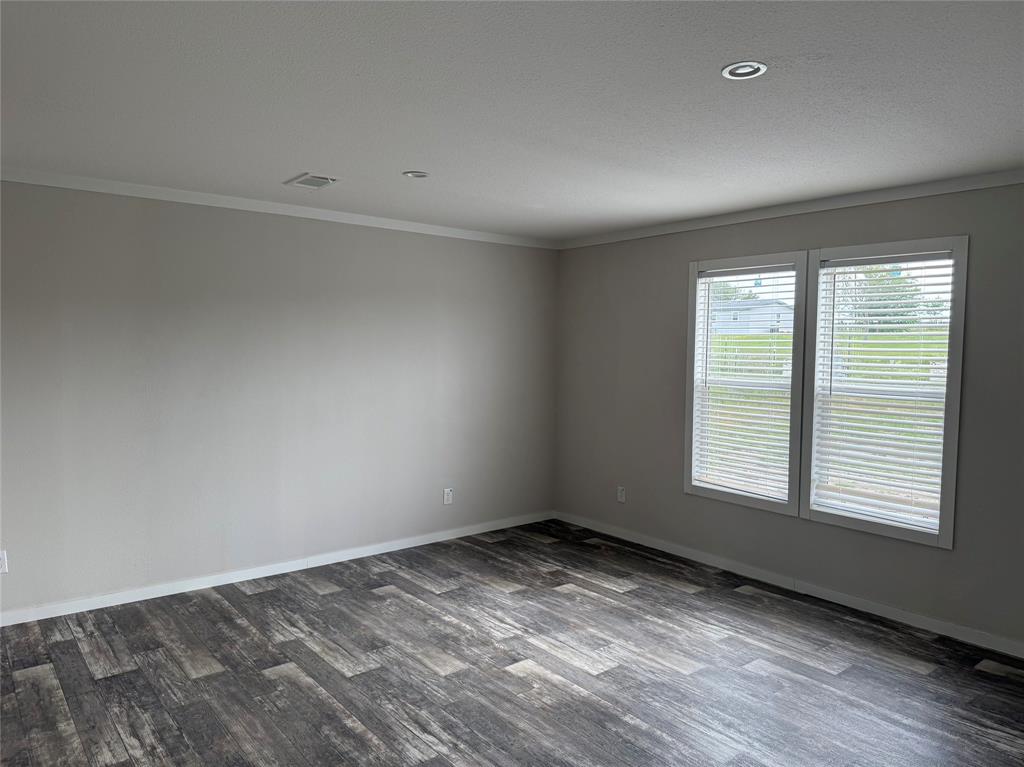 163 Red Fox Court Weatherford, TX 76088 - Photo 16 of 22 wooden floor in an empty room with a window