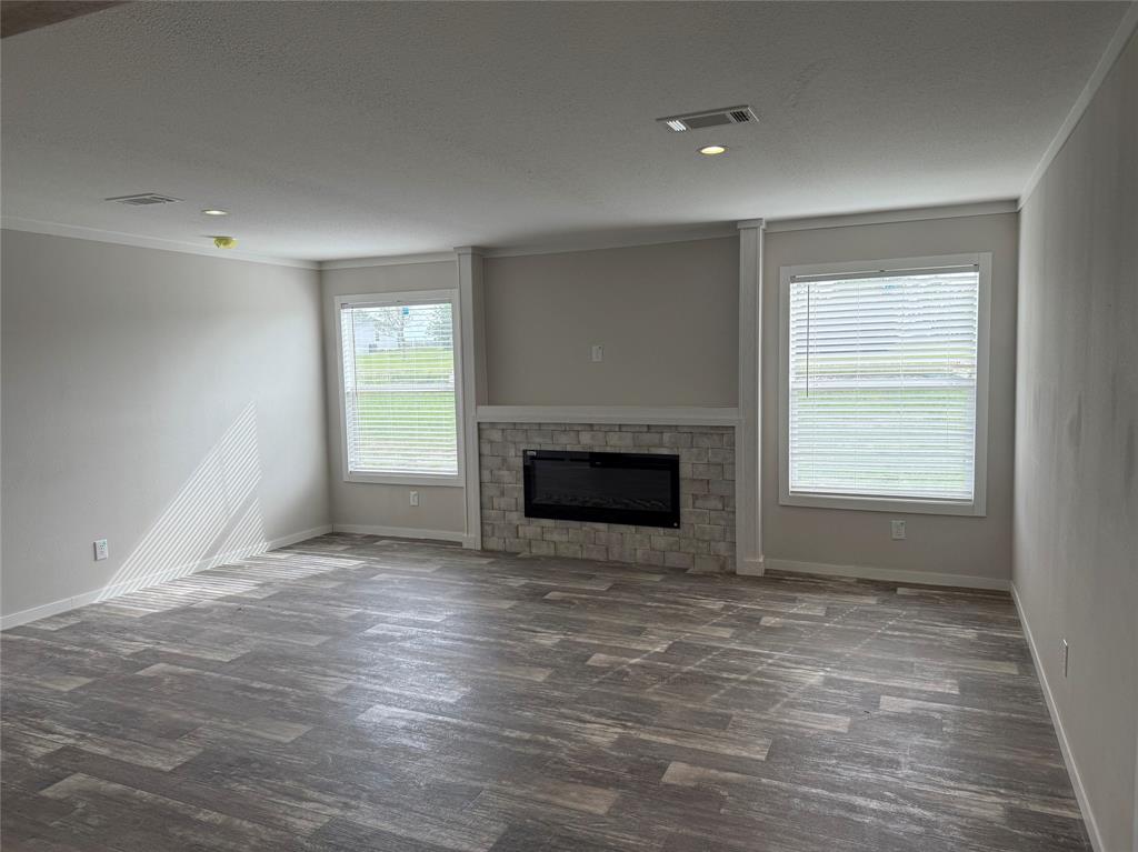 163 Red Fox Court Weatherford, TX 76088 - Photo 6 of 22 a view of empty room with a fireplace